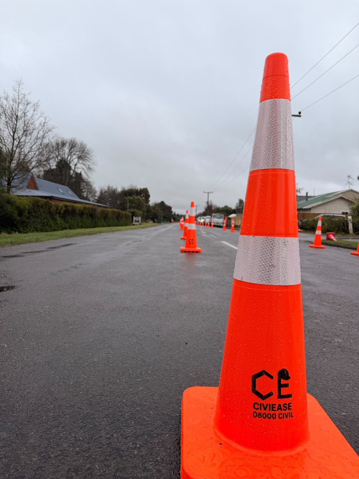 A branded CiviEase traffic cone protecting a live road work zone